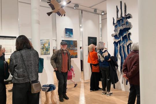 People in Gallery 2 seeing the 'Decade' exhibition